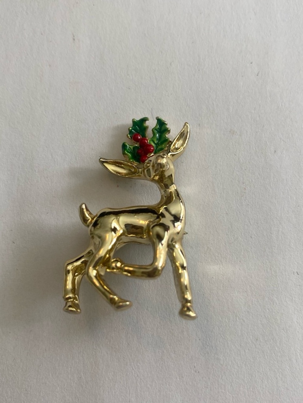 Vintage Gold Reindeer Brooch with Green and Red Holly Accent